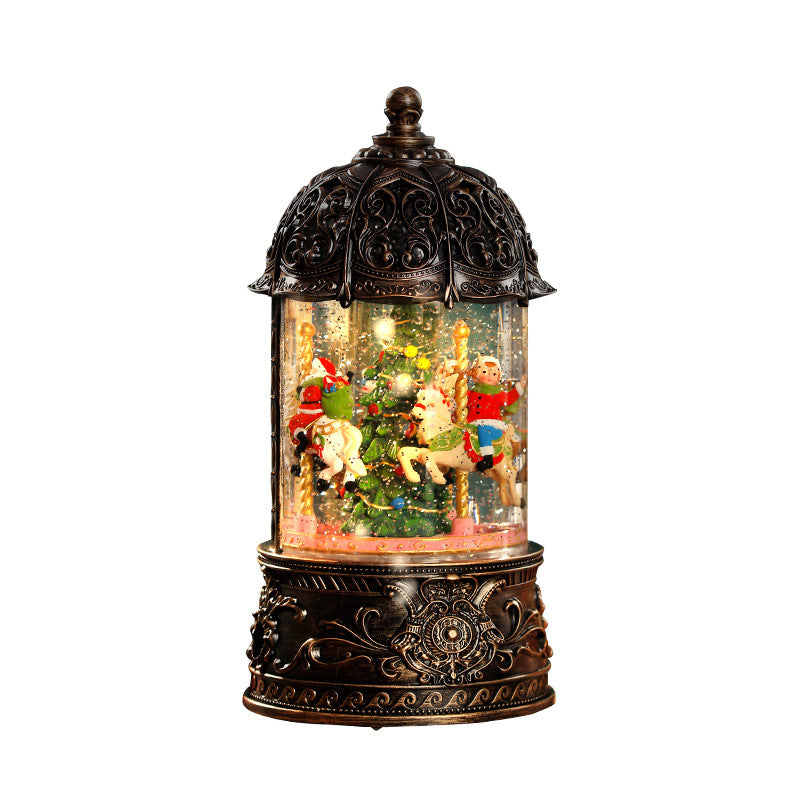 Decorative snow globe with Christmas scene inside a ornate lantern on a white background