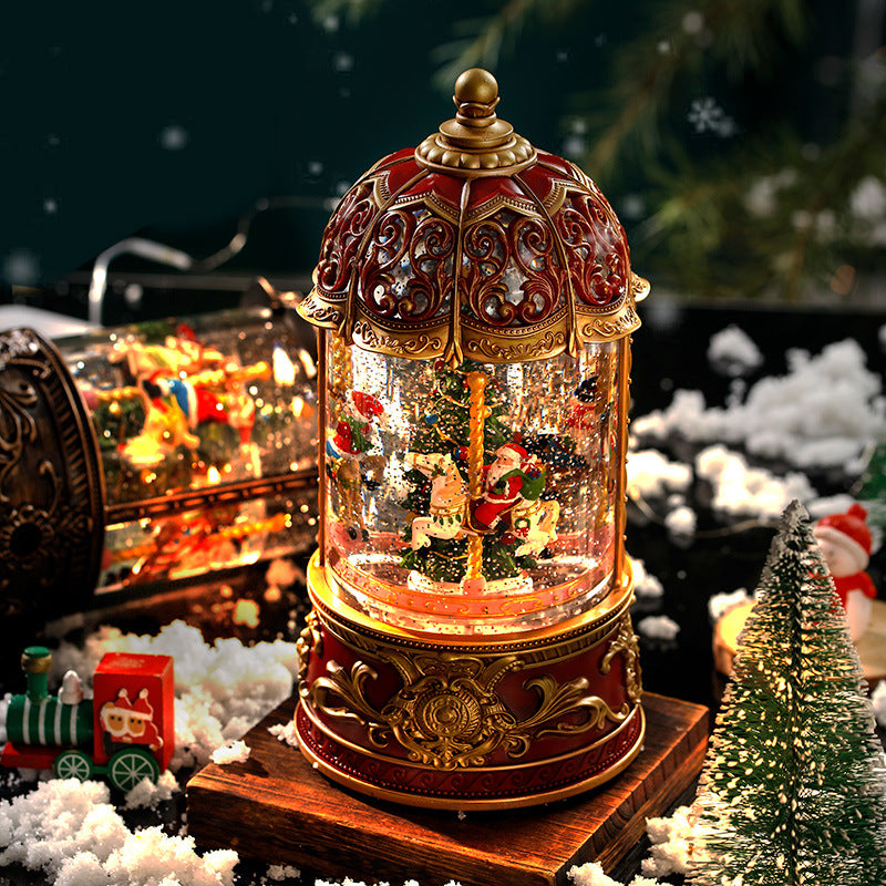 Decorative Christmas snow globe with Santa Claus and reindeer on a snowy background