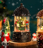 Decorative lantern with carousel scene inside, surrounded by Christmas decorations.
