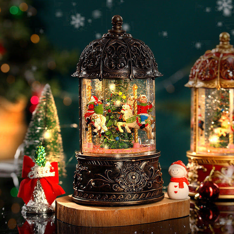 Decorative lantern with carousel scene inside, surrounded by Christmas decorations.