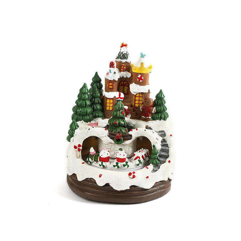 Decorative Christmas village scene with houses, trees, and figures on a white background