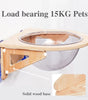 Pet feeding station with wooden base and metal bowl, labeled 'Load bearing 15KG Pets'.