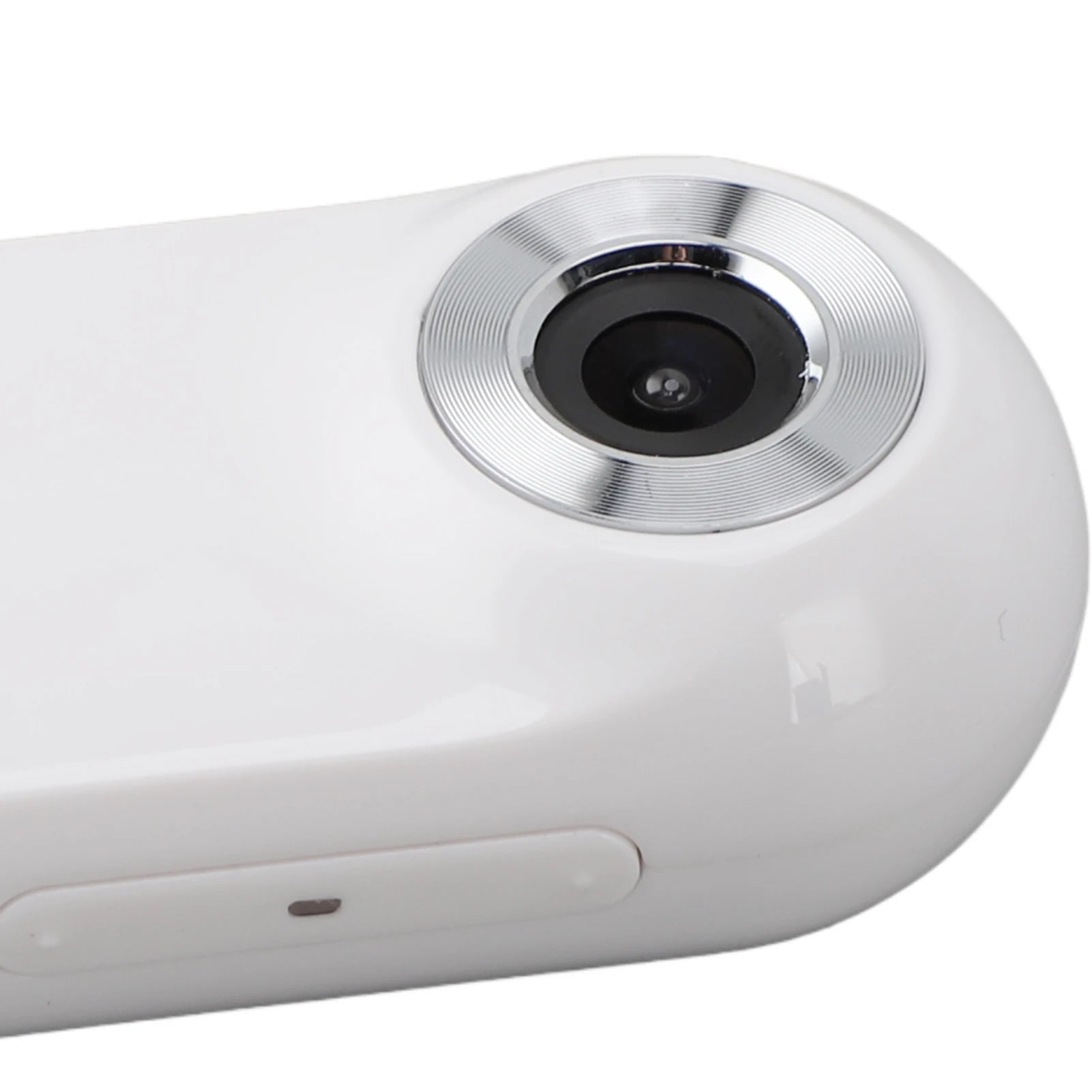 Close-up of a white electronic device with a camera lens on a white background