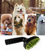 Dog grooming brush with dogs in the background