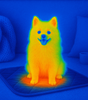 Dog on a heating pad with a thermal imaging effect, showing body heat distribution.