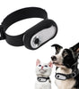 Pet tracking device on a white background with a dog and cat wearing collars.