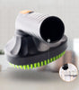 Cleaning brush with green bristles on a light gray background