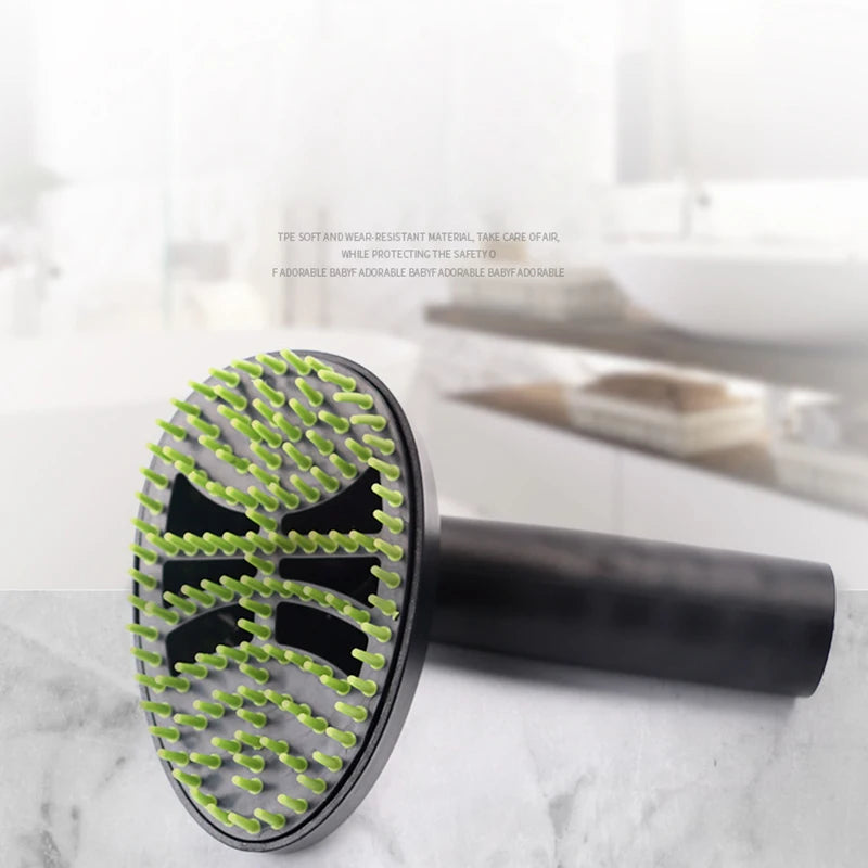 Hairbrush with green bristles on a marble surface