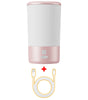 Pink and white pet paw cleaner device with charging cable on a white background