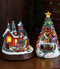 Two Christmas-themed decorative lights on a wooden surface with a dark background.