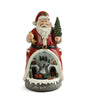 Decorative figurine of Santa Claus with a small village scene inside, on a white background.