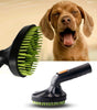 Pet grooming brush with green bristles next to a dog being bathed