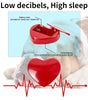 Red heart-shaped calming device with battery slots and switching key, labeled 'Low decibels, High sleep', on a light blue background.
