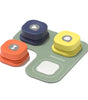 Colorful dog talking toy set with a base and three stacked pieces on a white background