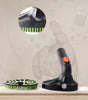 Pet Cleaning tool with brush and handle on a light background