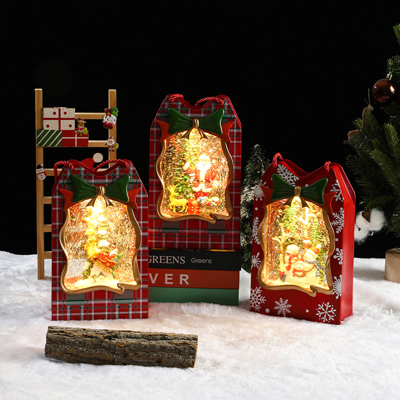 Decorative Christmas lanterns in plaid boxes on a snowy background