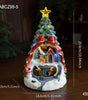 Decorative Christmas tree with a house at its base, featuring lights and a star on top, on a dark background.